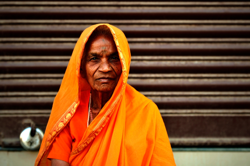 Photo of a woman in orange in India.