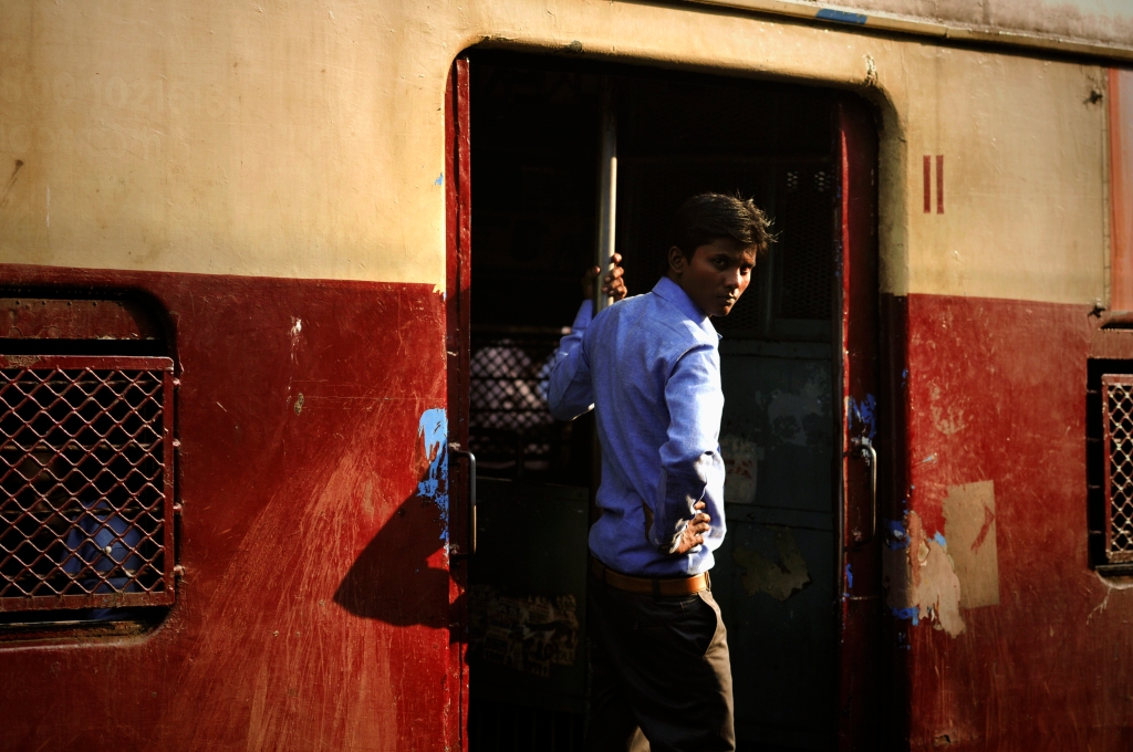 Photo of an Indian man on a train in India.