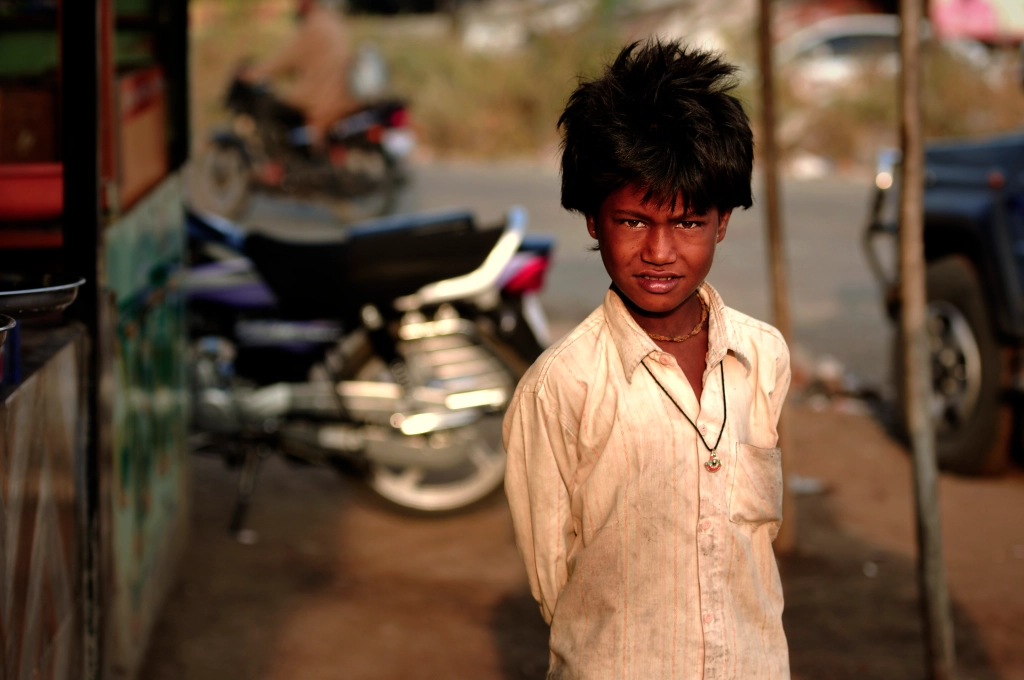 Photo of a boy in a white shirt in India.