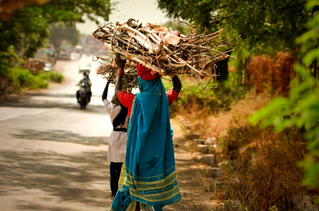 Photo of Indian women walking at the road in India.