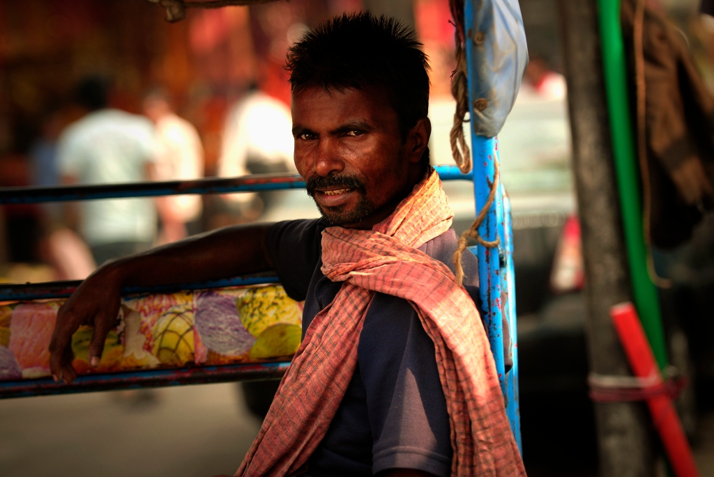 Photo of a rickchaw driver in Delhi, India.