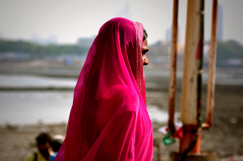 Photo of an Indian woman wearing a pink sari.