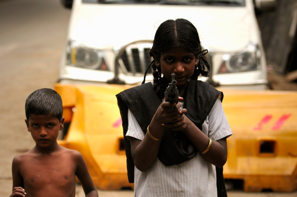 Photo of a toy gun girl in India.